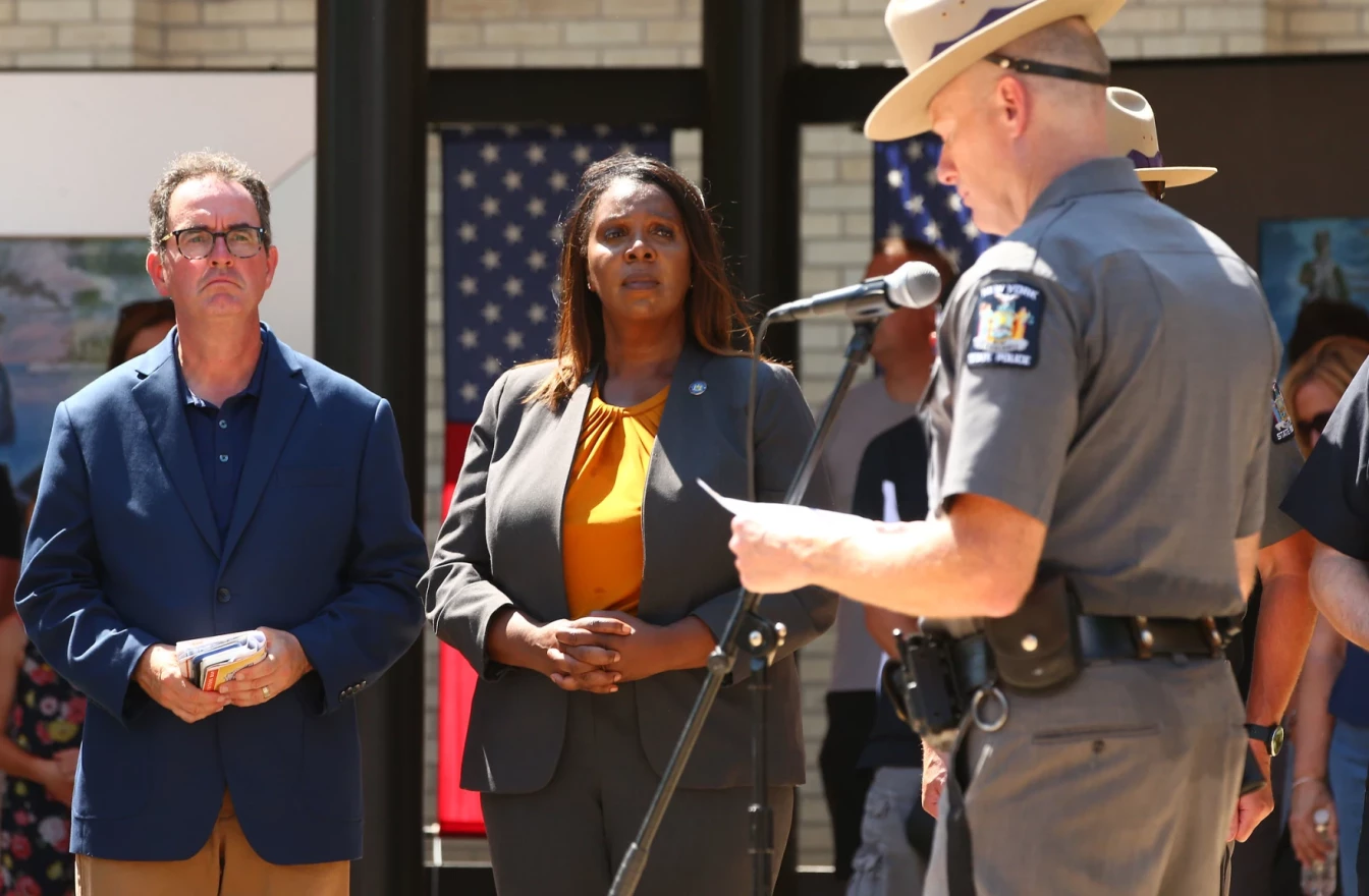 MICHAEL OKONIEWSKI /NYS FAIR Interim NYS Fair Director Sean Hennessey and NYS Attorney General Letitia James listens as the names of the fallen are read during ceremonies to honor law enforcement at the NYS Fair on Monday Aug. 29, 2022.